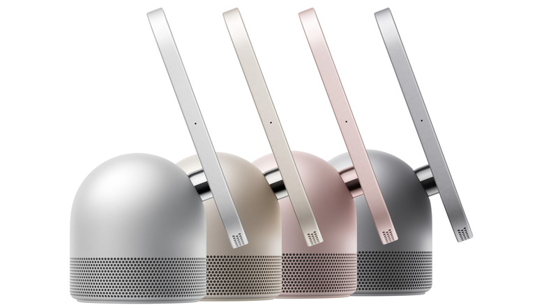 Side view of a device with a smart display attached to a base with a speaker in four colors: silver, starlight, rose pink and space gray