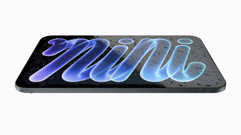 An iPad mini with water droplets on the display.