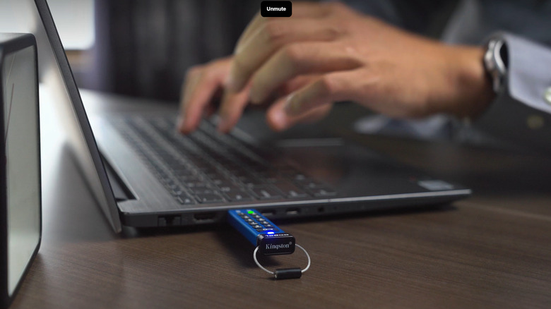 Kingston IronKey Keypad 200 USB flash drive with its built-in keypad plugged into a laptop.