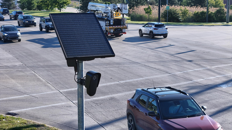 Flock Safety license plate reader overlooks parking lot