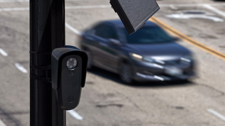 An aerial view of a Flock Safety camera mounted to a light pole.