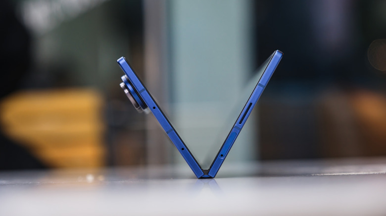 A partially folded Galaxy Z Fold with its massive camera bump.