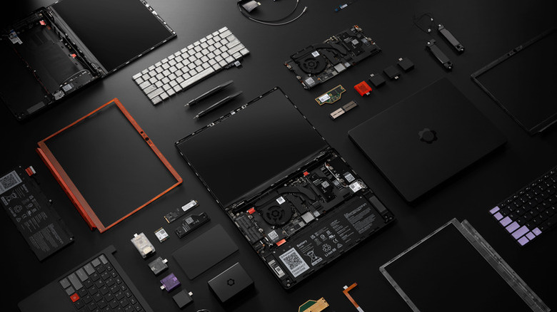 Laptop 13 Pro components laid on a table.
