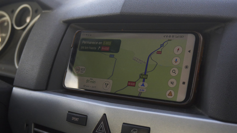 Dashboard infotainment screen displaying GPS navigation.