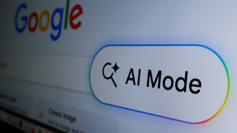 Photo of a screen displaying the Google homepage with an AI Mode button popped out in the foreground.