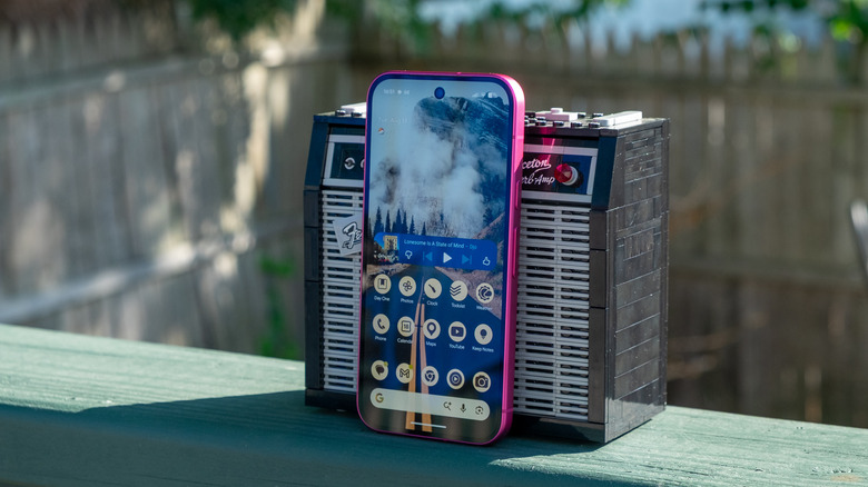 A Pixel 11 smartphone leaning against a small Lego amplifier.