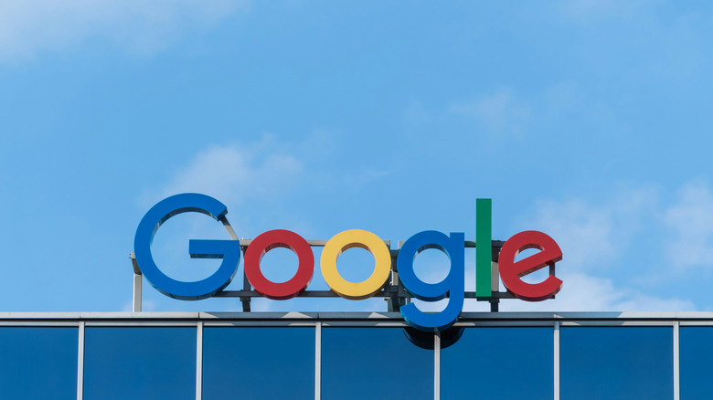 Google's logo on top of a building against a blue sky