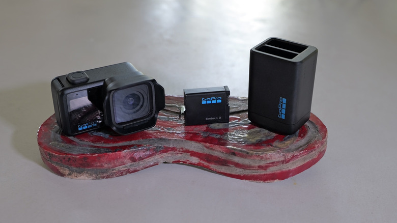 GoPro Mission 1 Pro shown with battery and new charger