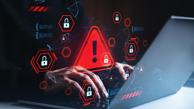 Illustration of hands at a laptop with images of caution and danger floating above the keyboard.