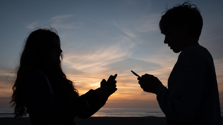 Children using their smartphones.