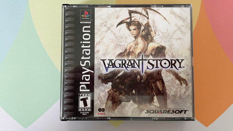 A copy of Vagrant Story for the PlayStation sits on a colorful mouse mat.