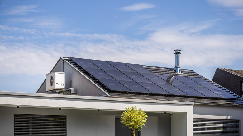 A house with a roof covered in solar panels.
