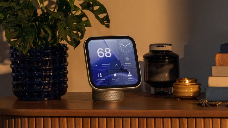 Apple's HomeView on its regular base, sitting on a table.