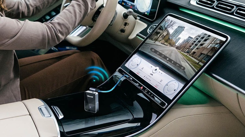 A mock up of an Ottocast device connected to a car display.