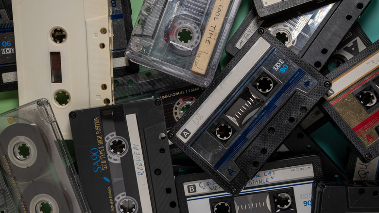 A stash of cassette tapes in a pile.