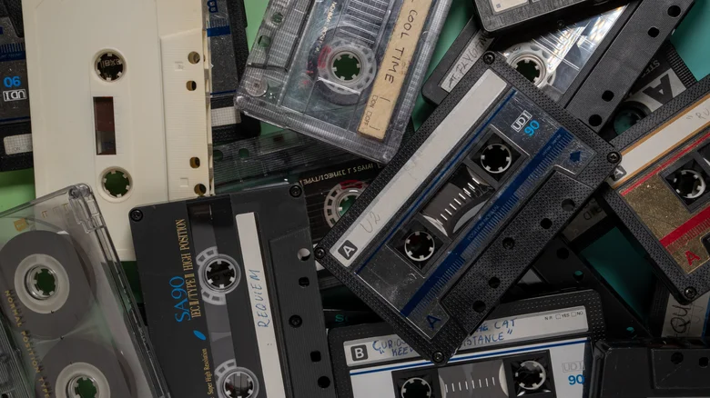 A stash of cassette tapes in a pile.