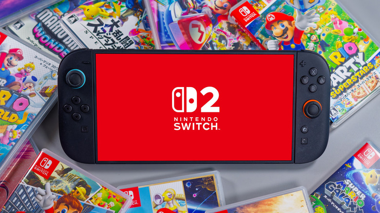 Nintendo Switch 2 console surrounded by physical Nintendo Switch game cases.