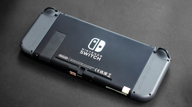 Rear view of an original Nintendo Switch showing the kickstand, vents and Nintendo Switch logo.