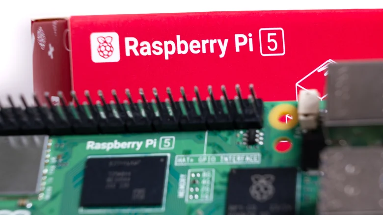 Raspberry Pi 5 set against red product box.