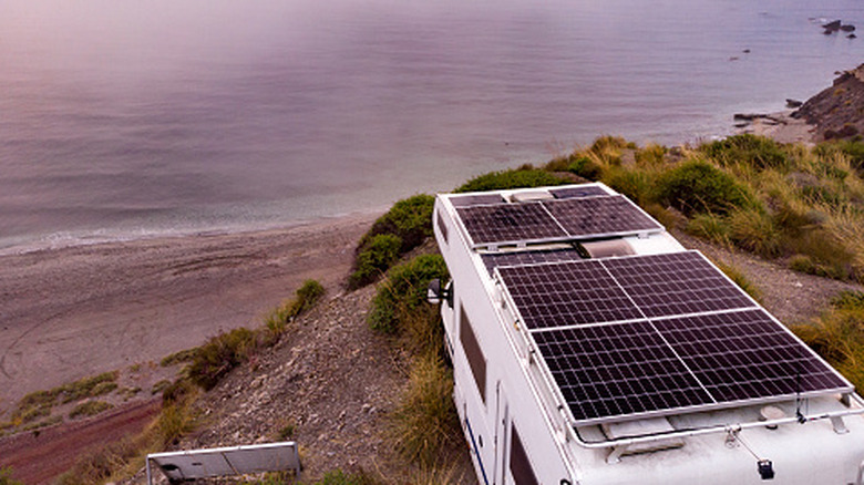 Image of a camper RV with solar panels.