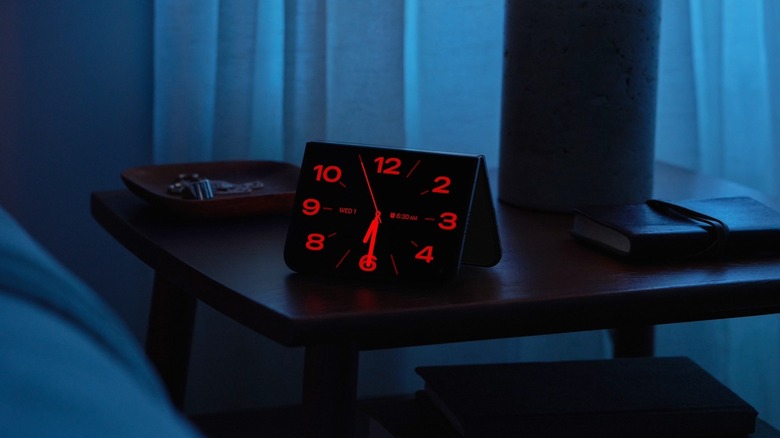 iPhone Duo in "tent" mode working as a bedside clock.