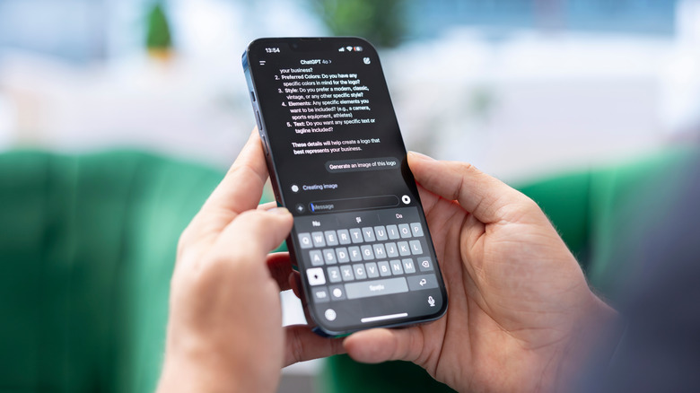 A person holds an iPhone displaying a ChatGPT conversation with an image-generation request.