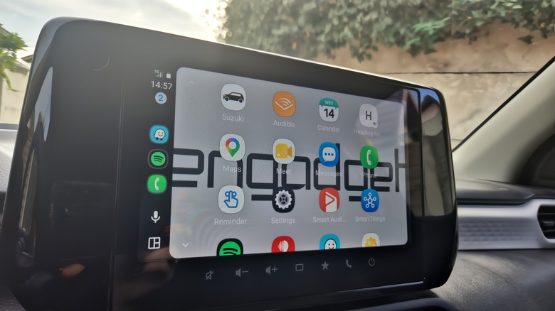 Android Auto on Suzuki Swift display, the Engadget logo in the background.