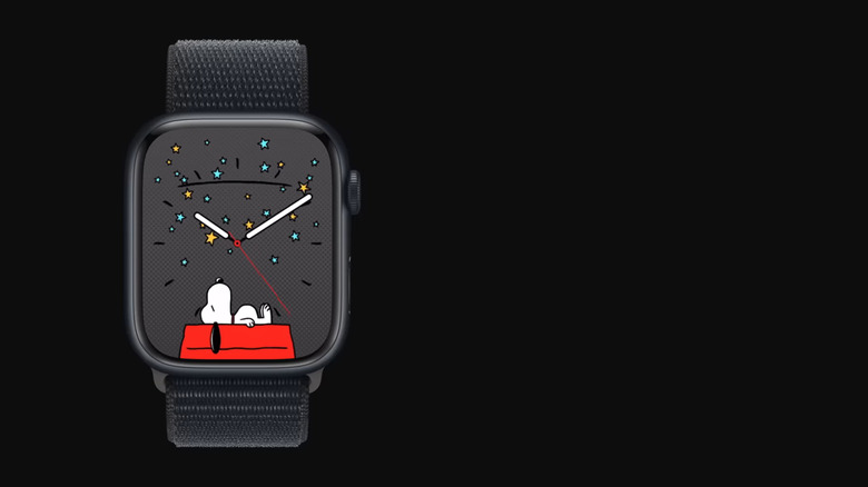 A black Apple Watch showcases the beloved cartoon character Snoopy lying asleep on his dog house beneath black sky with blue and yellow stars.