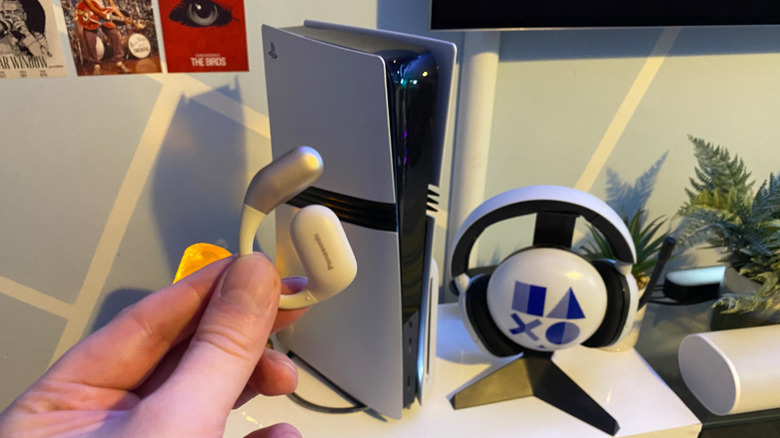 Panasonic Bluetooth headphones in front of a PS5 Pro