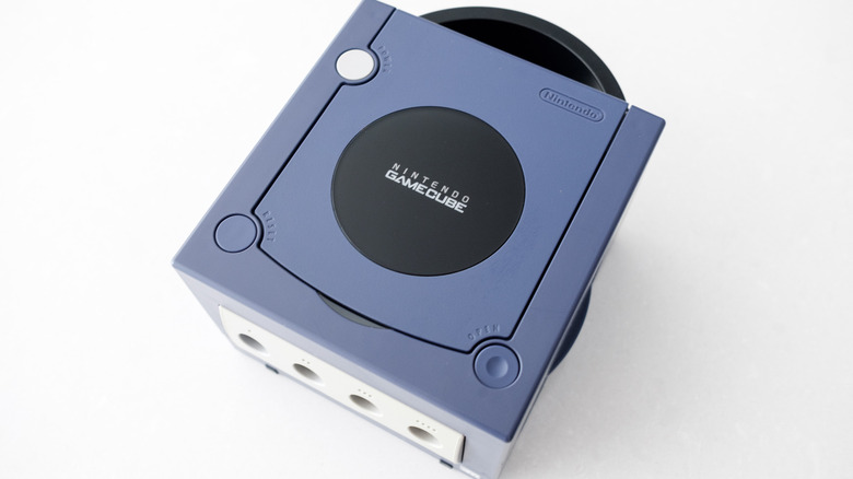 An Indigo Nintendo GameCube sits on a white marble countertop.