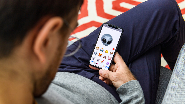 Man creating Memoji on an iPhone