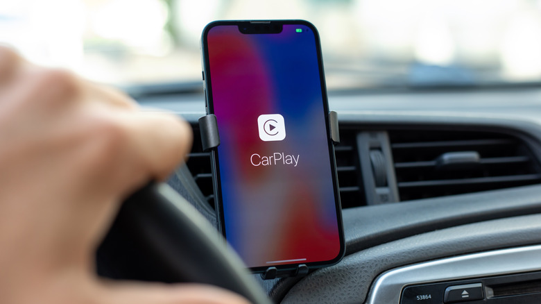 An iPhone paired with Apple CarPlay.