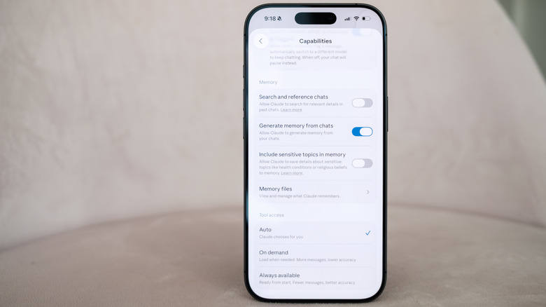 An iPhone 17 shows Claude's Memory menu.