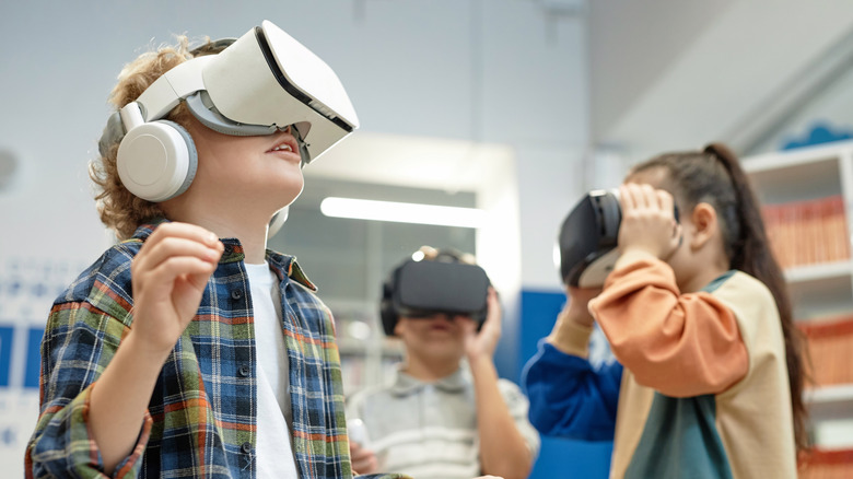 Group of children using VR headsets.