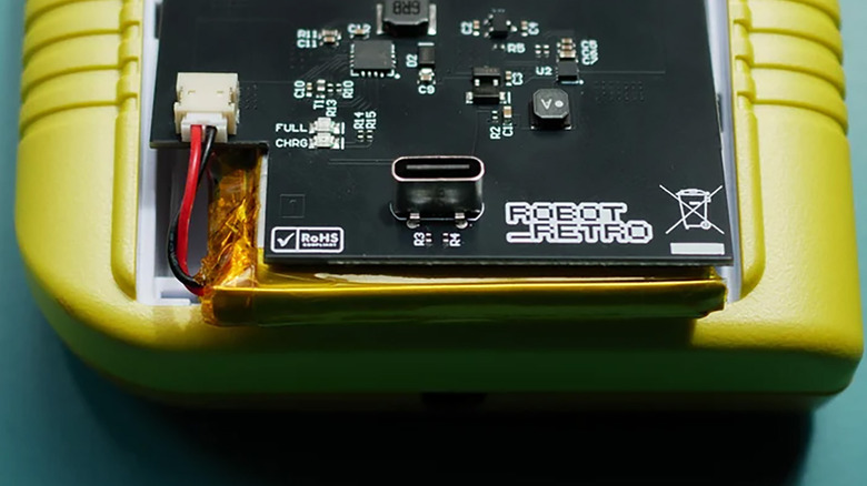 Closeup of a Game Boy with a USB-C battery mod installed.