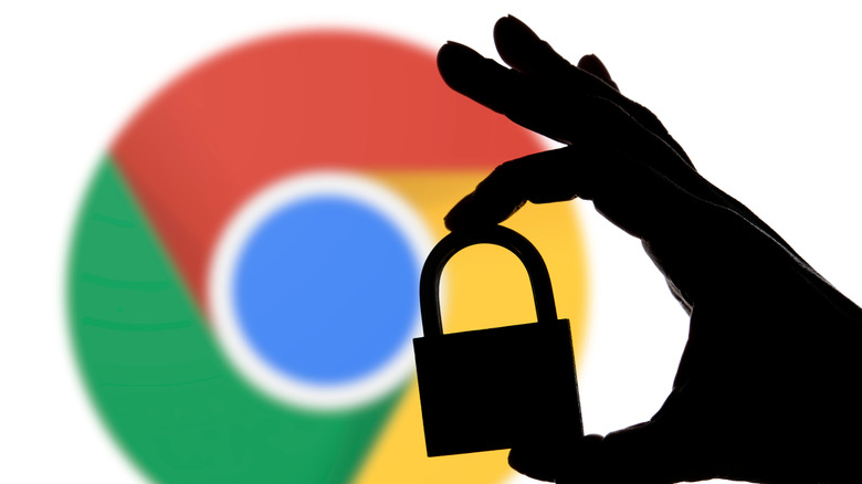 Google Chrome logo with a silhouette of a hand holding a lock in the foreground.
