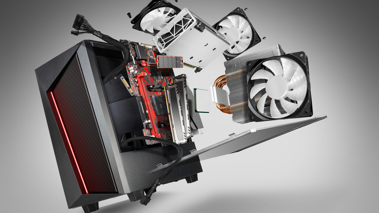 PC case with fans and coolers flying out.