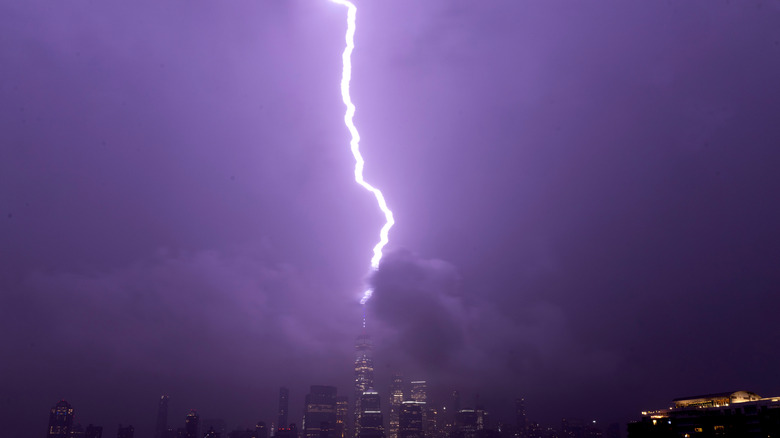 Lightning hitting a lightning rod on top of a building