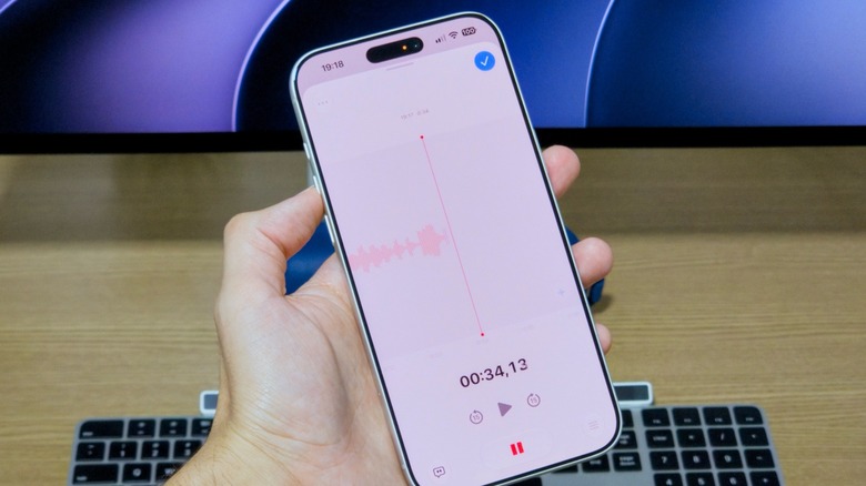 Recording a voice memo using Apple's built-in app on an iPhone.