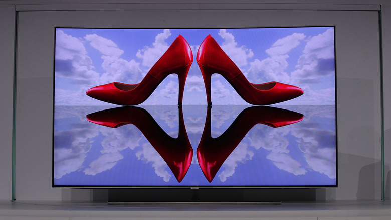 A Samsung TV with mirrored, high-heel shoes on screen.