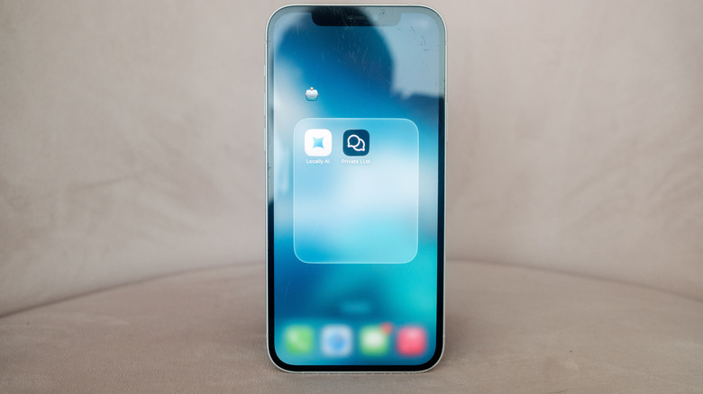 A folder icon on an iPhone 12 shows a pair of local AI apps.