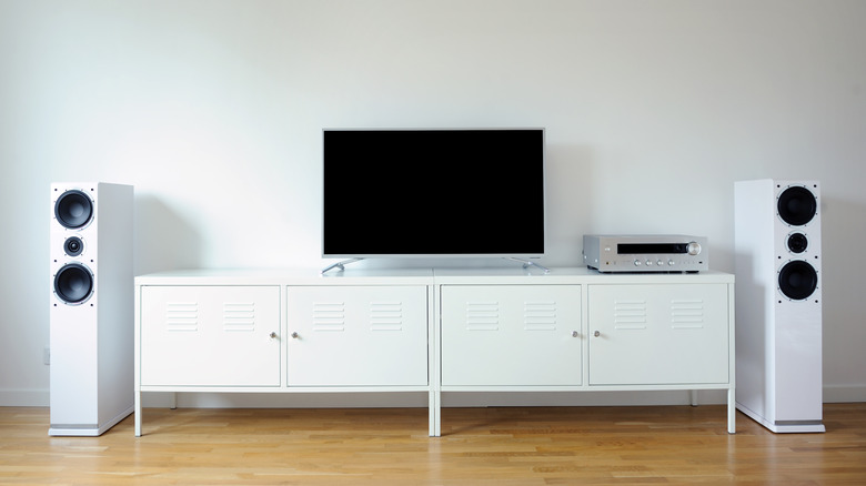 A TV with an AV receiver and left and right speakers.