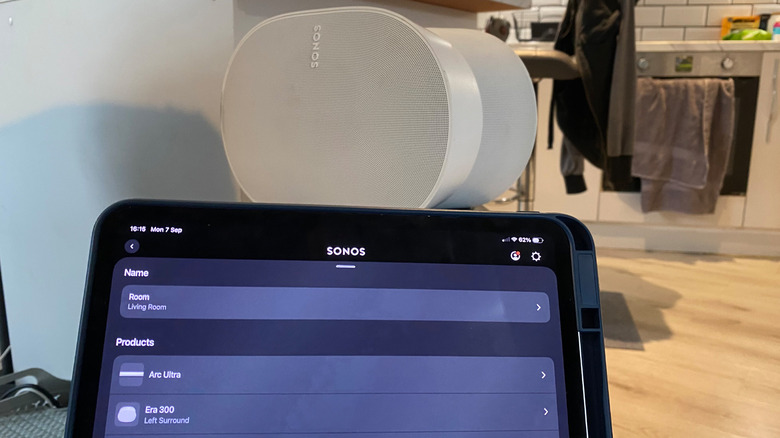 The Sonos app on an iPad in front of a Sonos Era 300 speaker.