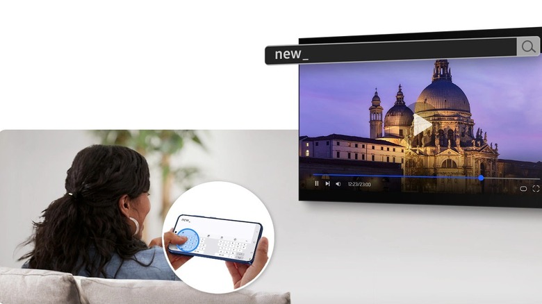Woman controls wireless Samsung DeX instance on a TV