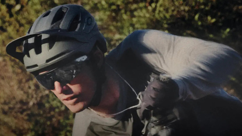An action shot of a man wearing Oakley Meta glasses.