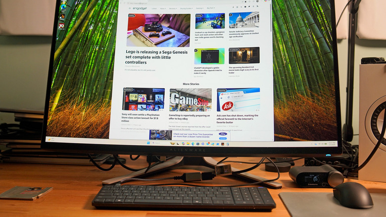 The EliteBoard G1a on a desk powering an Alienware monitor.