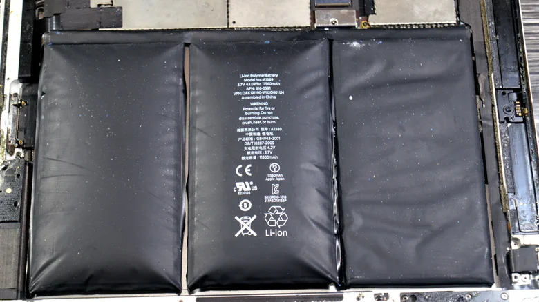 Swollen battery cells inside a device.