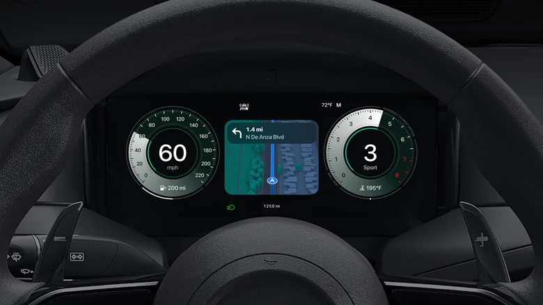 A black car dashboard shows Apple Maps between the car's speedometer and the tachometer.