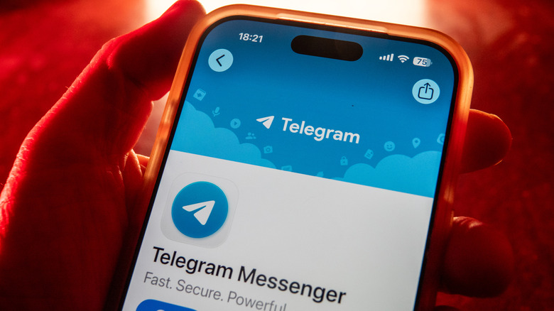 An image shows the Telegram app with a red background