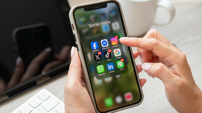 A phone showing social media apps